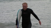 SX08870 Marijn with surfboard at Porth Beach, Newquay.jpg